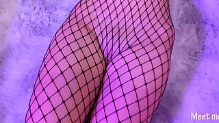 Asian in fishnet gives a footjob with the addition of gets cum all over her pussy